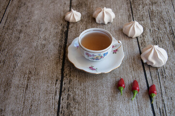 vintage tea cup with meringues around