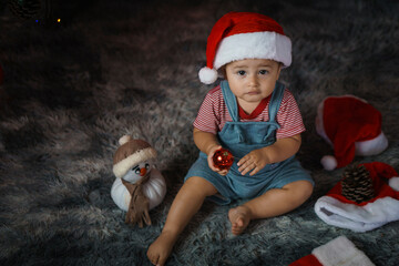 baby child in santa claus hat 