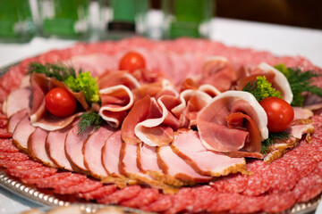 sliced ham meat sausages on the festive table