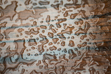 close up of water droplets on blackboard