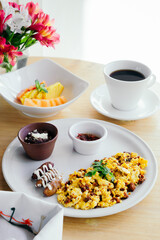 Delicious breakfast with fruit, juice and coffee on a white background. Food.