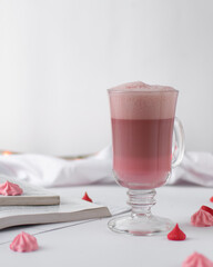 Ombre Pink latte layered in a latte glass, trendy pink beverage