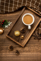 Christmas decorations and coffee on  wooden background. christmas concept.