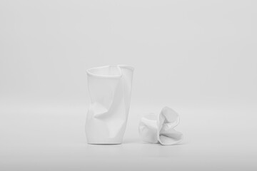 paper cup crumpled in a white background