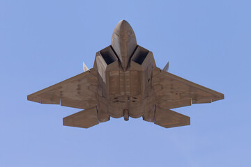 Bottom view of a F-22 Raptor approaching 