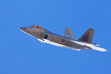 Very close view of a F-22 Raptor approaching in beautiful light