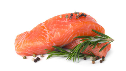 Pieces of fresh raw salmon and spices on white background