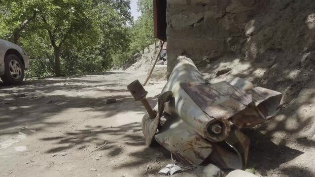Unexploded powerful rocket with hand grenade on side, Pashir valley, Afghanistan
