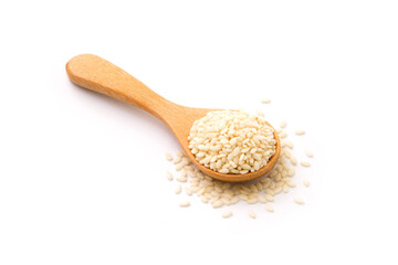 White sesame seeds in wooden spoon isolated on white background.