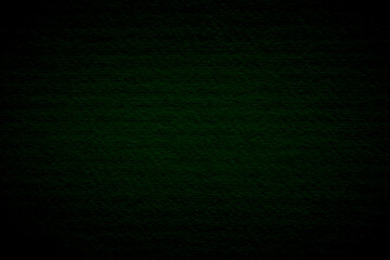 Green dark concrete texture wall background on black. Wallpaper pattern curved rough dark cement stone. 