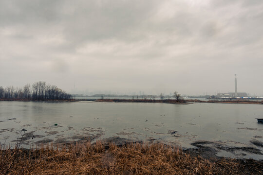 Toronto On A Stormy Day From Tommy Thompson Park With An Industrial Tower