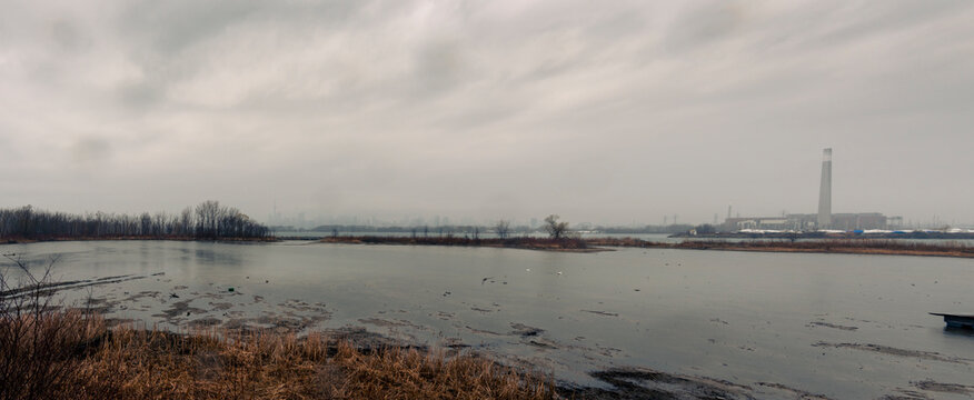 Toronto On A Stormy Day From Tommy Thompson Park With An Industrial Tower