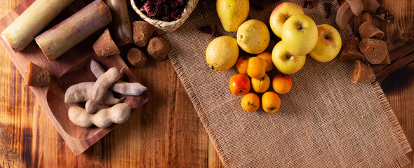 Basic ingredients to prepare Mexican fruit punch, a hot drink traditionally consumed during the December season at posadas and Christmas celebrations.