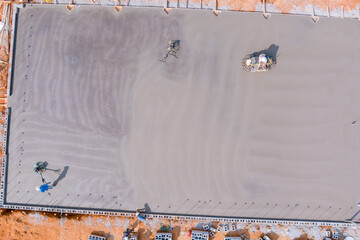 This process entails polishing and leveling cement screed mortar floors on construction site before...