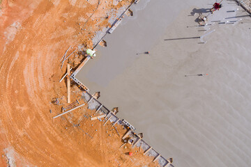 Polishing and leveling cement screed mortar floor on construction site is craftsman performing