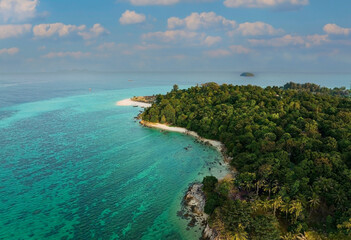 Aerial view of  tropical with seashore as the island in a coral reef ,blue and turquoise sea...