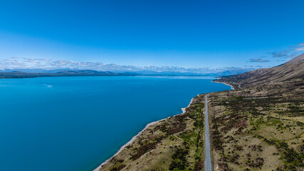 Aerial view of Landscape view of  mountain range near Aoraki Mount Cook and the road leading to Mount Cook Village in New zealand