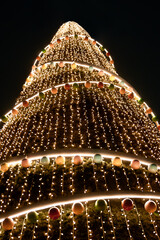 giant christmas tree. close up of christmas tree. lighting in shopping mall. end of year lights and decorations. holidays in latin america. 