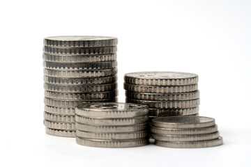 Mini house on a stack of coins. The concept of investment property, lending, growth and borrowing.