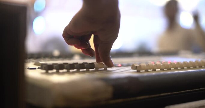 stage light control board dmx controller playing close up shot  blur background