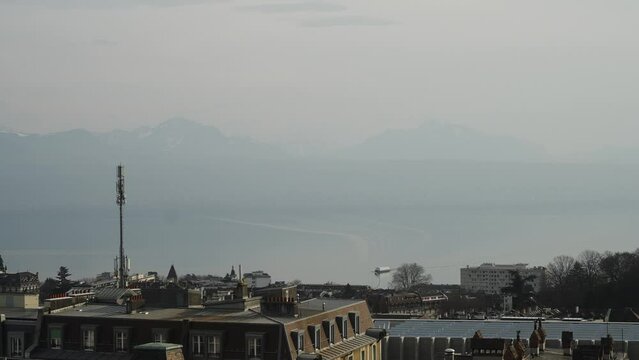 Tourism boat on Lausanne lake with alps in background (4k 30p Slow Motion)