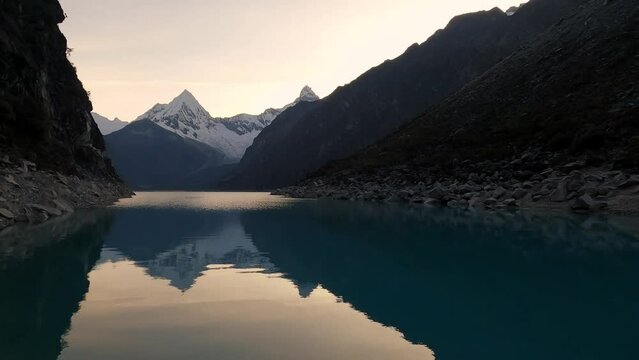 panoramic of Lake Paron, Pyramid Mountain reflection on still water Andean Cordillera in Peru Huascaran National Park, Peruvian Hiking Destination