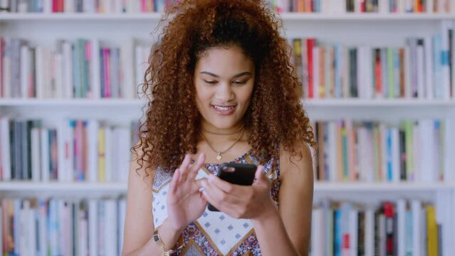 Library, woman and student with phone news on email app for scholarship admission in Mexico. Happy, excited and gen z girl with college education opportunity internet update and notification.