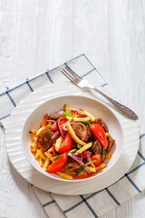Lomo saltado, fried beef, french fries, veggies