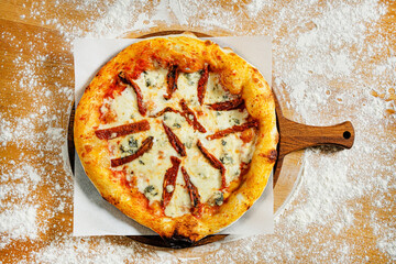 homemade pizza on the wooden board