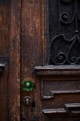 Texture of old wooden door with green handle
