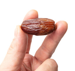 Dried date in hand isolated on white background.