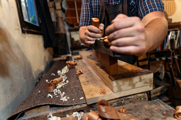 Fototapeta na wymiar Luthier Working in his Workshop