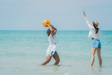 Beautiful girls and friend having fun together on the beach,Nice weather in travel and holiday concept.