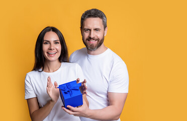 couple with surprise present, banner. holiday couple with surprise present box. photo of couple