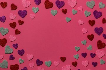 Multicolored hearts on a pink background