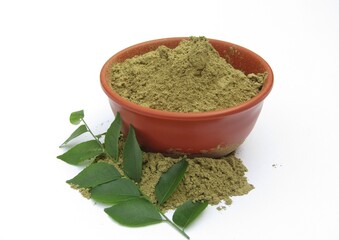Curry leaves powder in a bowl on white background 