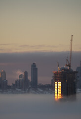 A thick fog blanket covering Metro Vancouver on a winter morning during sunrise in Burnaby, British Columbia, Canada