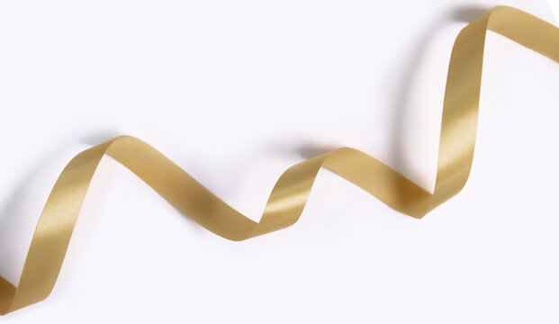 Golden riboon for decoration christmas, new year, anniversary, card, poster or birthday white background.