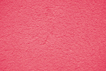 Fototapeta premium Background of peeling Magenta paint on an old textured wall. Color Of The Year 2023 - Viva Magenta.