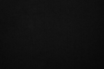 Black paper texture background. Black blank cardboard sheet page. Old vintage page dark grunge vignette. 