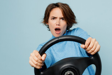 Young displeased sad caucasian woman wearing knitted sweater look camera hold steering wheel...