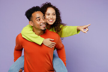 Young couple two friends family man woman of African American ethnicity wear casual clothes...