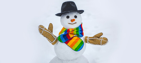 Snowman at a snowy outdoor. Making snowman and winter fun.