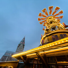 Christmas market in Paderborn, Germany.  A huge pyramid shows the Christmas story.  The cathedral...