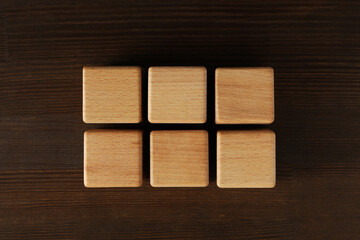 Blank wooden cubes for different concepts, top view