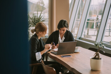 Brunette business woman writting