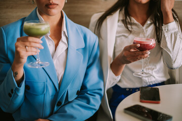 Close up of business women holding latte