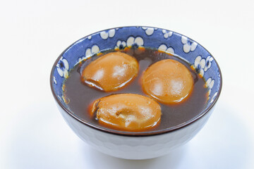 Thai Food Egg and Pork in Sweet Brown Sauce on White Background