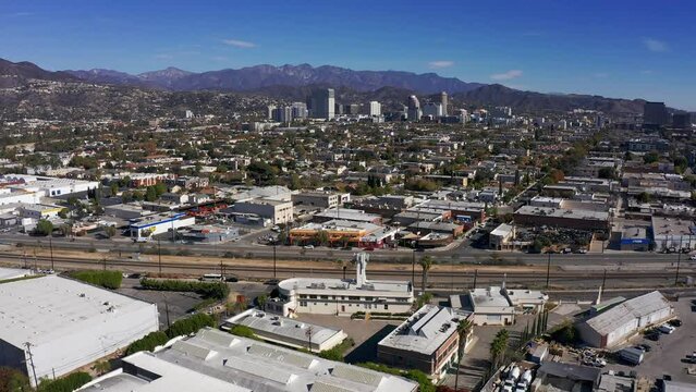 Aerial reverse pullback shot of downtown Glendale, California. 4K