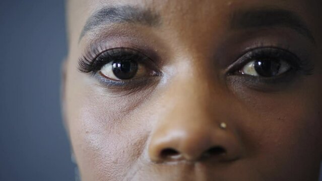 Portrait of serious black woman, eyes and face in awareness of human rights, racism and discrimination in Nigeria. African female closeup with vision for equality, empowerment and feminist revolution